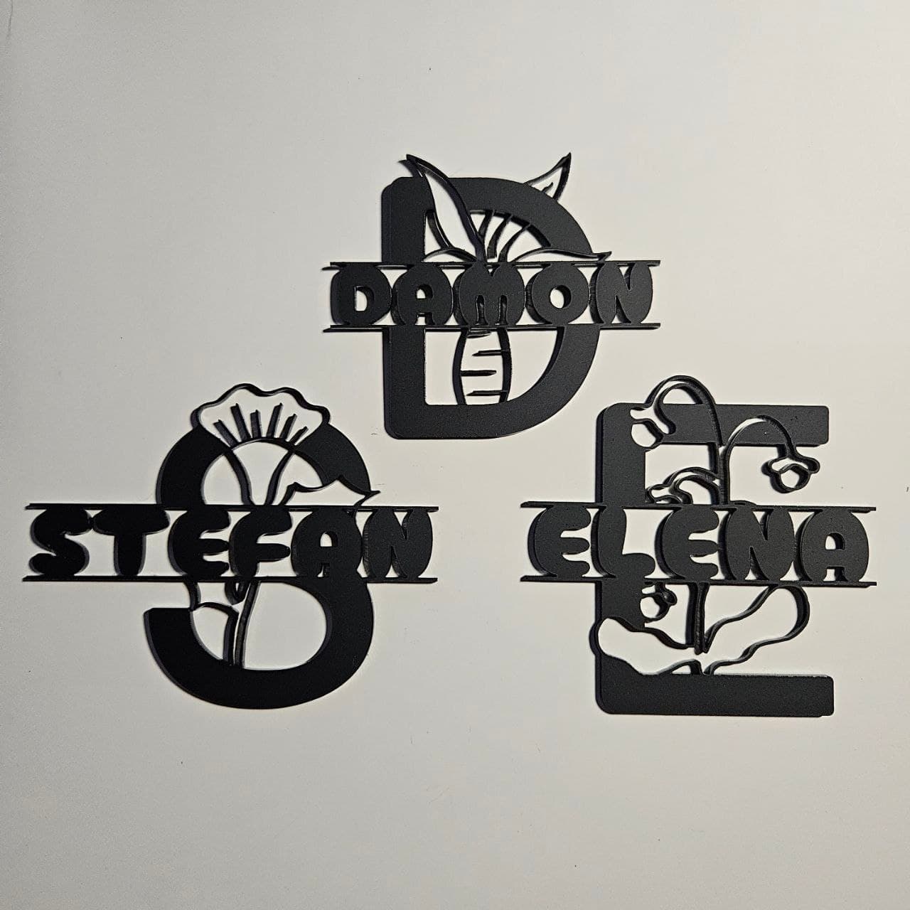 Split monogram made with one side frosted black acrylic