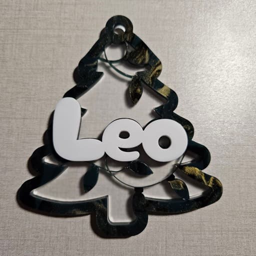 Christmas tree ornament made with frosted acrylic, green marble acrylic, and white acrylic