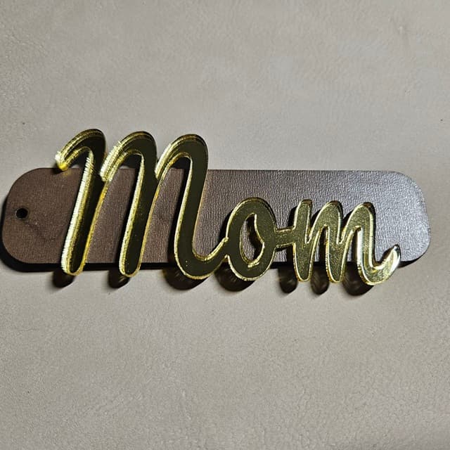 Beautiful stocking tag with Mom text in gold mirror acrylic and walnut plywood