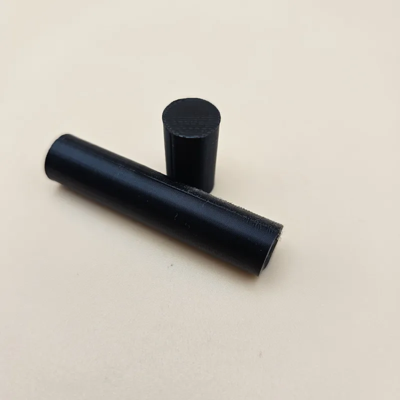 3D printed dowel pins in black PLA