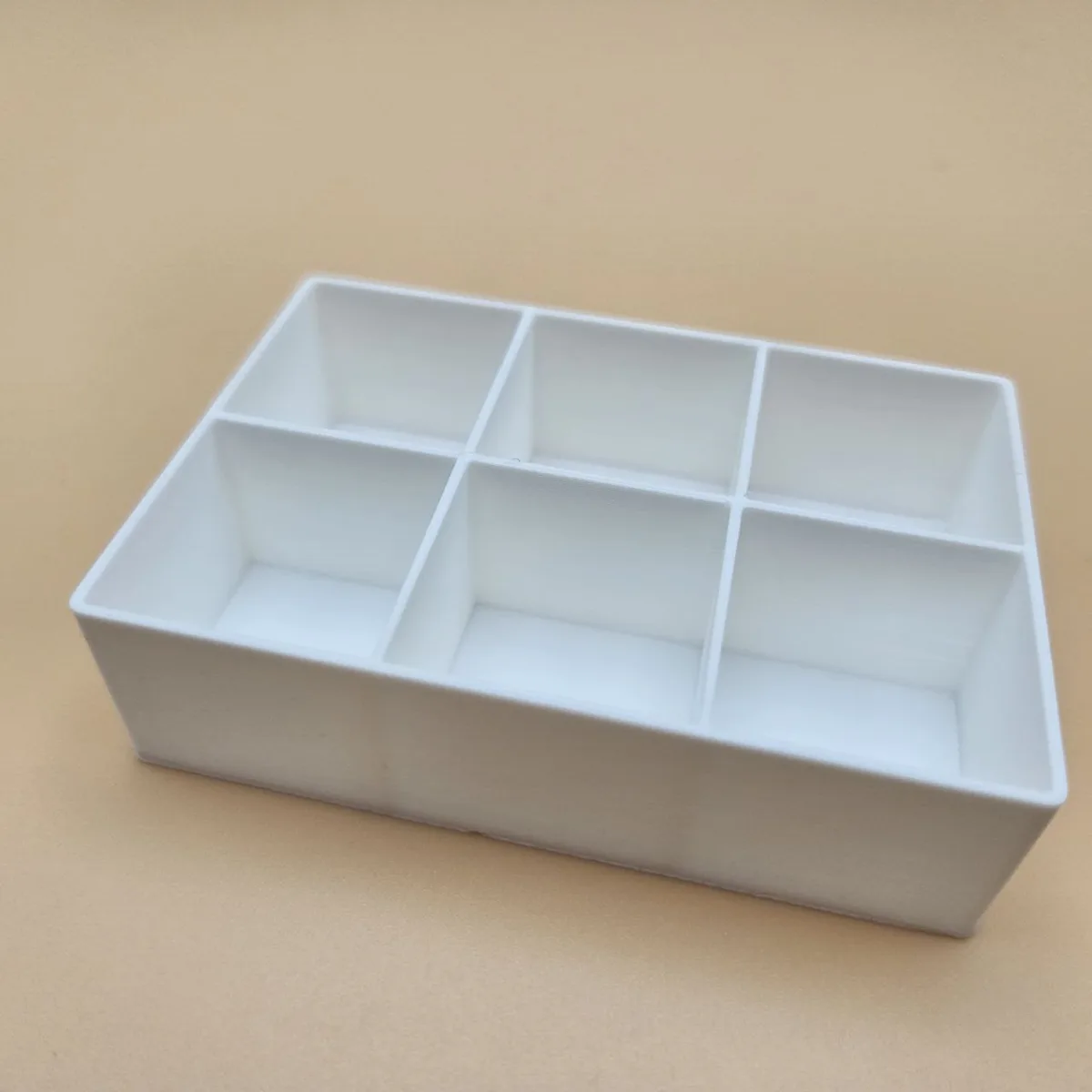 3D printed grid organizer box with 6 compartments in white PLA