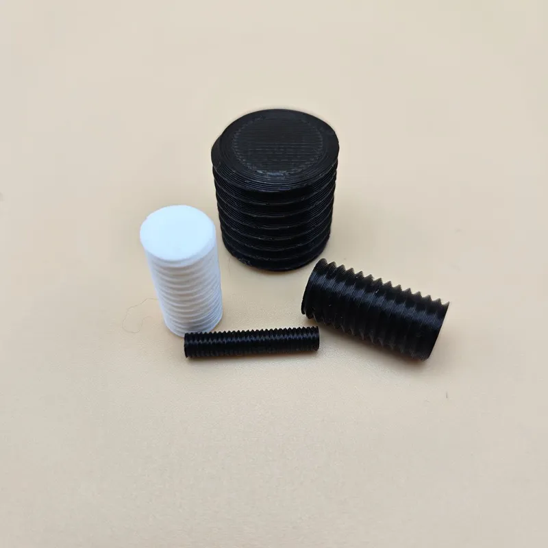 3D printed threaded pins and rods in black and white PLA